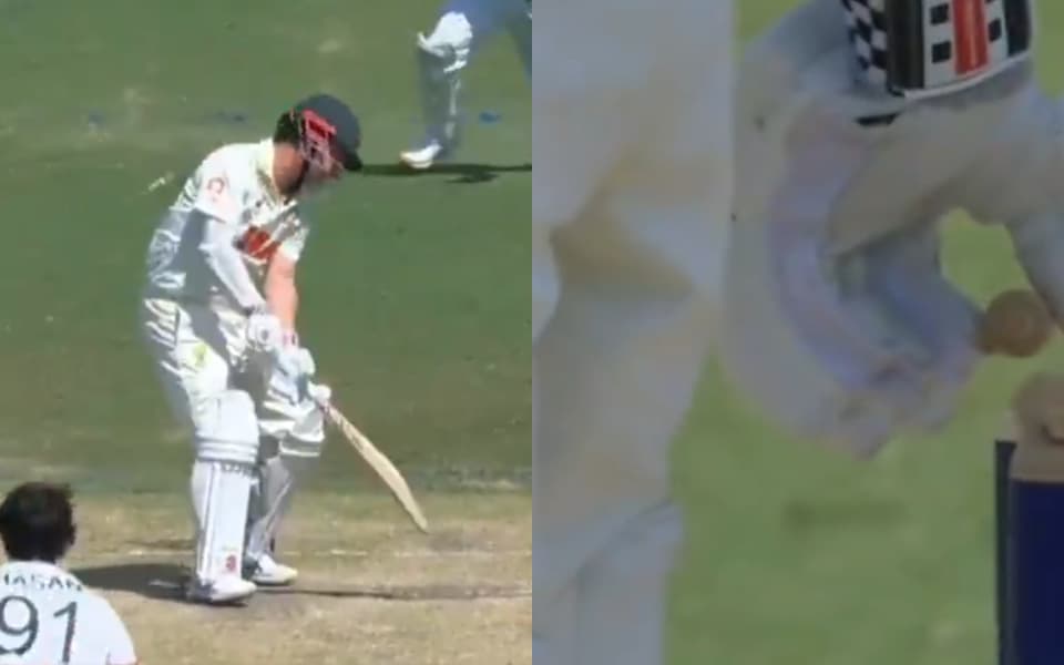 Travis Head replaces bails after being bowled by Hasan Mahmud in Darwin Test